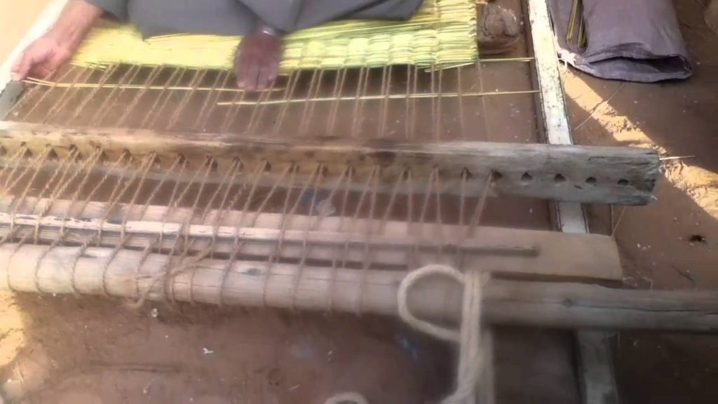 Loom of manufacturing mats Photo credit: https://i.ytimg.com/vi/E96vGS4uXHk/maxresdefault.jpg