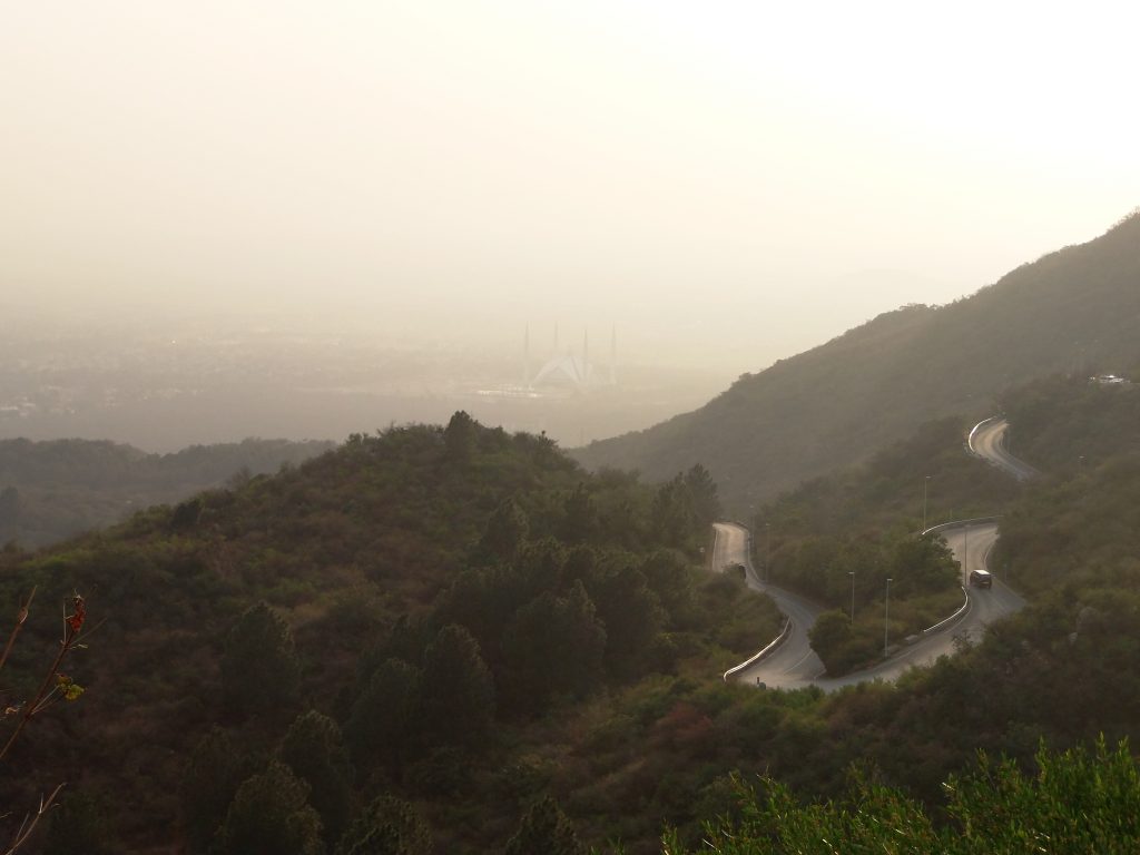 View of Faisal Mosque hidden behind the smog. And the road leading to Daman-e-Koh. Photo by the author.