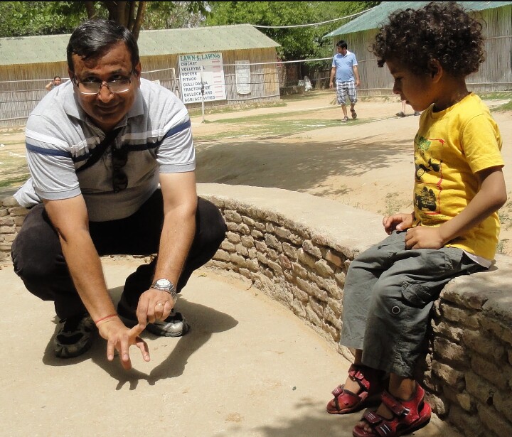 Parents teaching the game to kids pic credits : www.semwalonwheels.com