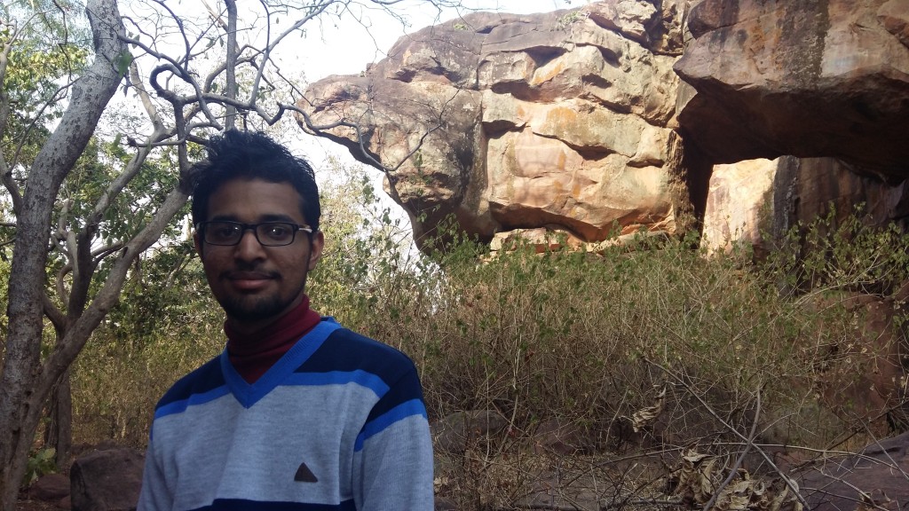 Me in front of bird shaped rock