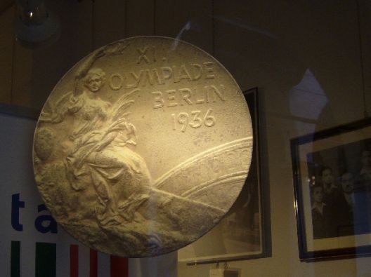 Bologna 2007,the Ondina Valla exhibit, reproduction of the gold medal Berlin Olympics of 1936, Photo courtesy –bibliotecasalaborsa.it