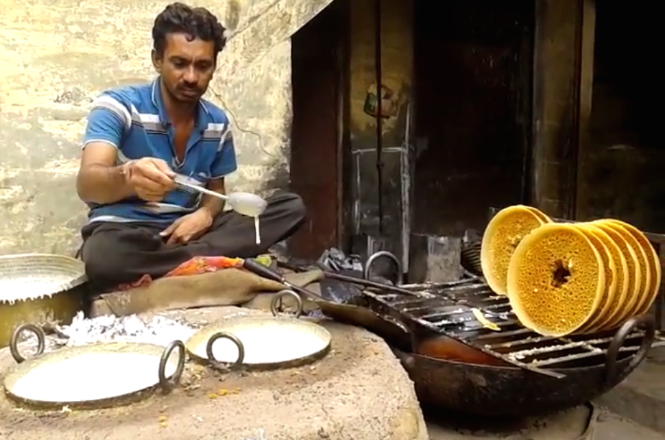 Ghevars being prepared in a traditional mould. Photo credit: Screengrab