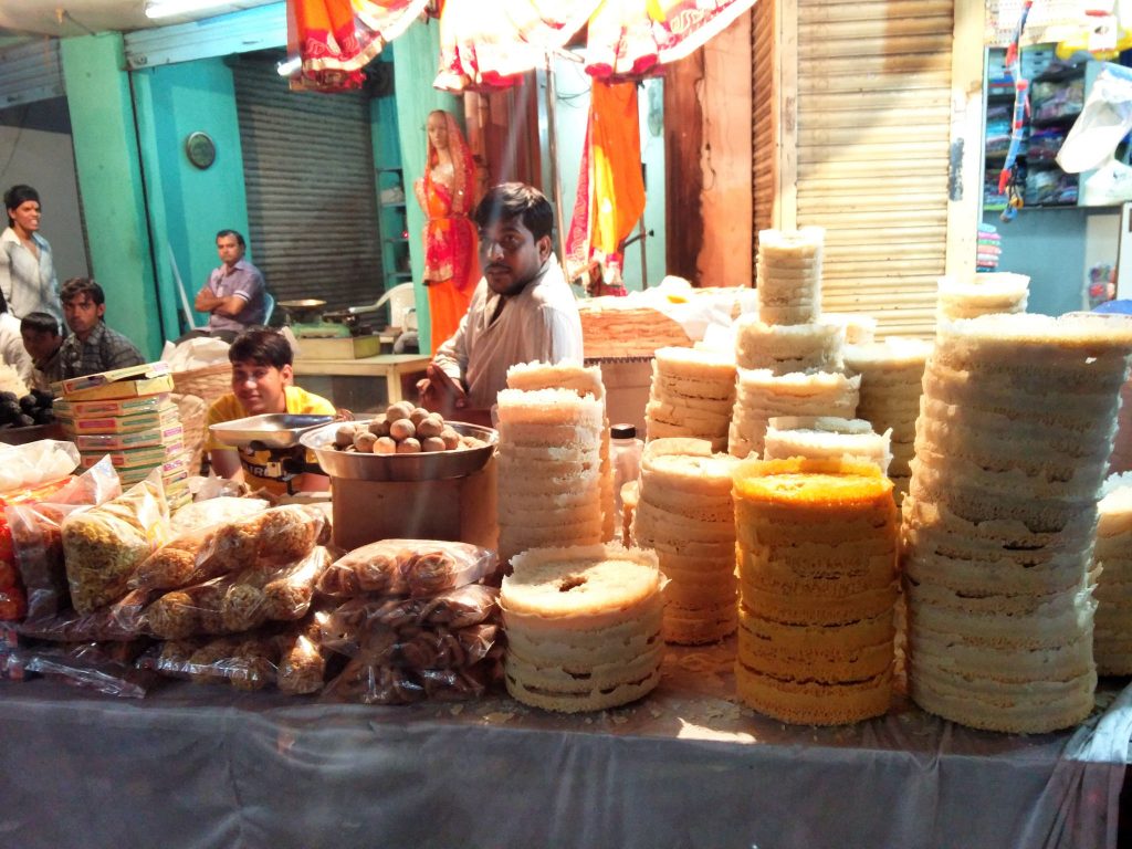 Stacks of freshly-made ghevar are ready to be sold in Hyderabad. Photo credit: Food Drifter/Flickr