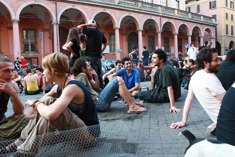 Young people chilling in front of the porticoes at Piazza Verdi. Photo credit: Flickr