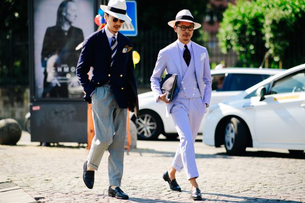 This shot of Pitti Uomo 92 by Adam Katz Sinding shows a couple of Asian gents socklessly cavorting down the pebbled stone streets of Florence.