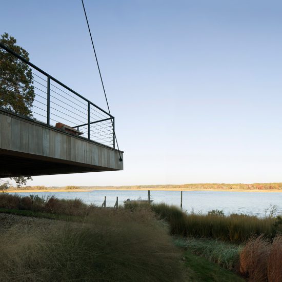 Overlooking the water in Southampton, Island Creek House is a non-conforming, small waterfront "townhouse" designed around strict environmental regulations