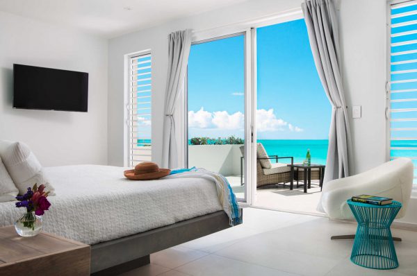 The indoor/outdoor style extends the hypnotic beauty that is seven shades of blue oceanfront
