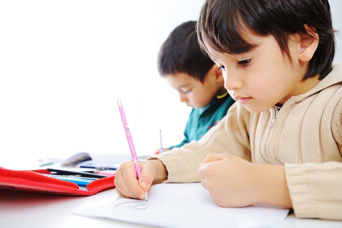 Young children studying