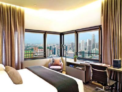 One of the bedrooms of a serviced residence at Oakwood Premier OUE Singapore