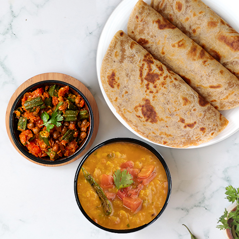 Yellow dal tadka, bhindi chana, paratha thali