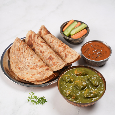 Palak chicken, dal makhani, parathas thali