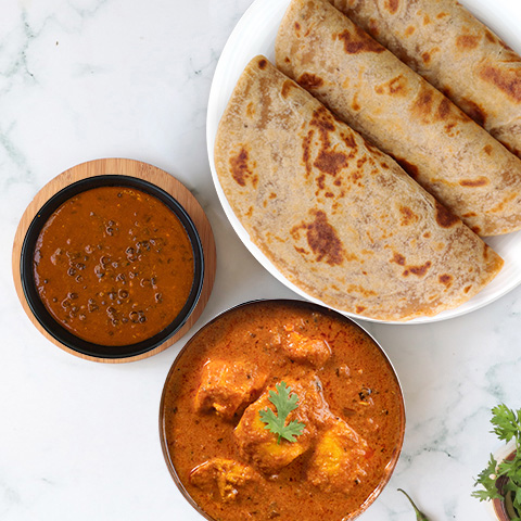 Butter chicken, dal makhani, paratha thali