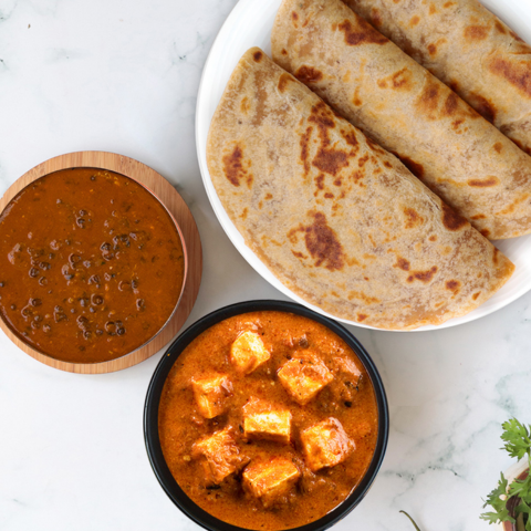 Butter paneer, dal makhani, paratha thali