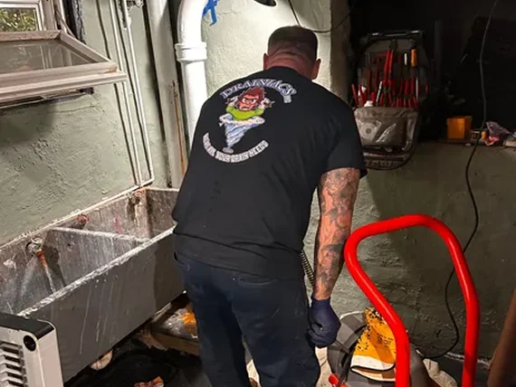 Plumber using diagnostic tools to inspect pipes