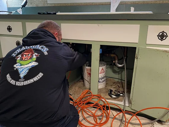 Skilled plumber completing a careful installation