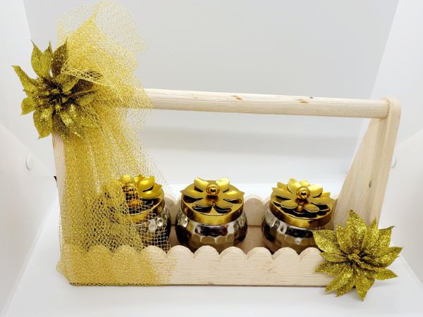 Wooden basket with metal jars and dry fruits