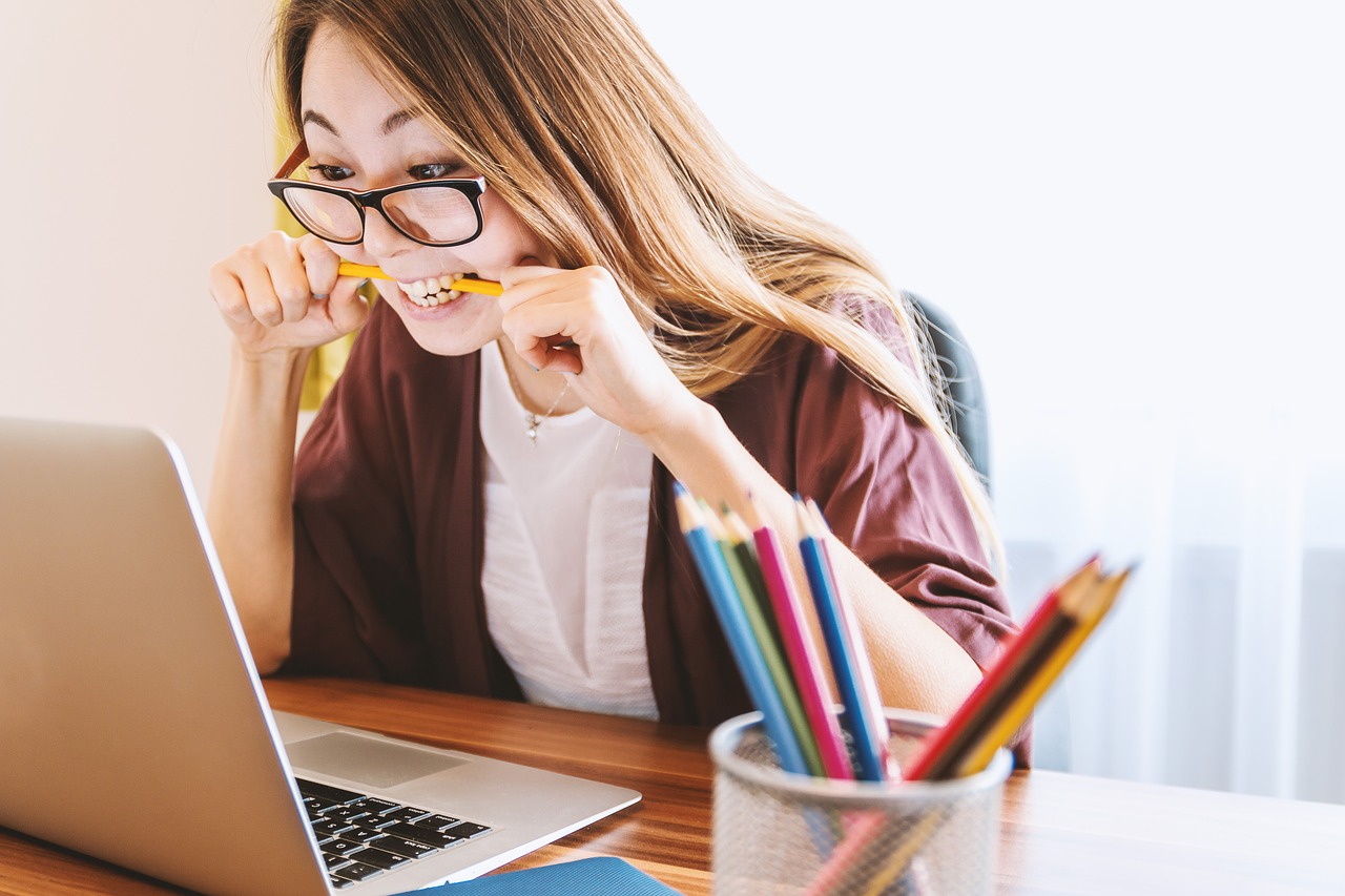 girl looking at a computer screen