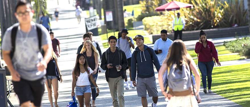 Crowd of college students walking on the street