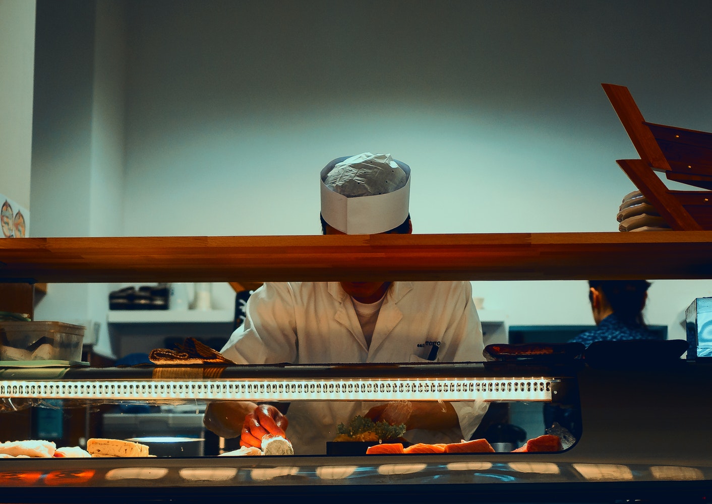 man preparing food on a kitchen restaurant