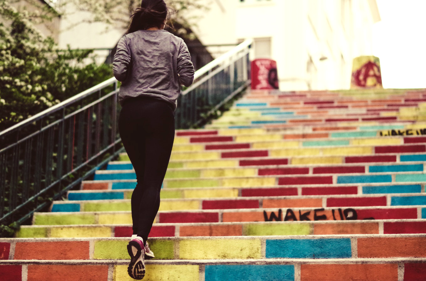 woman exercising to stay fit in college