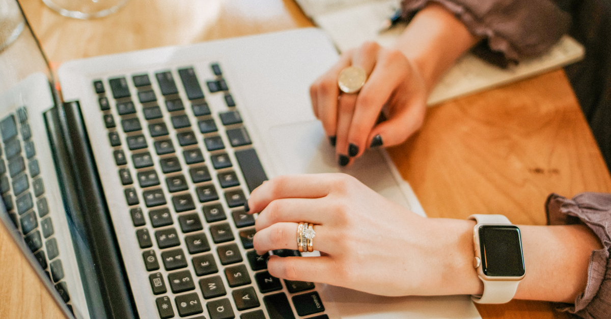 woman typing on laptop