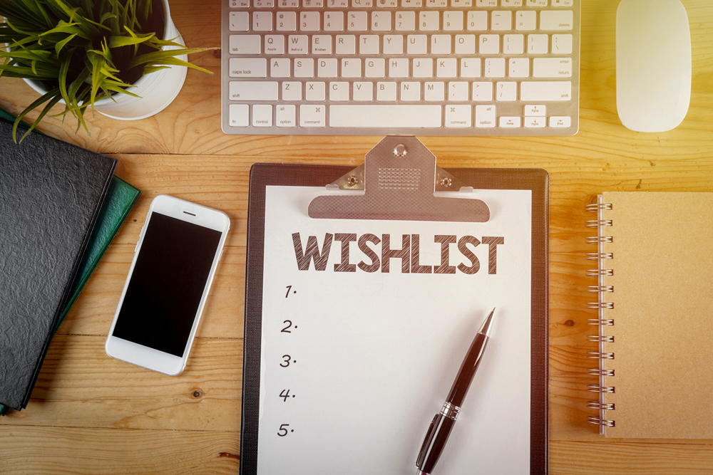 A pen lying on top of a blank wish list