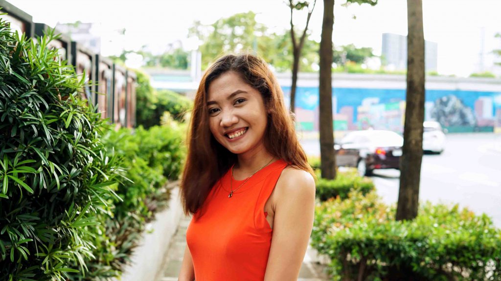 girl smiling in an outdoor setting