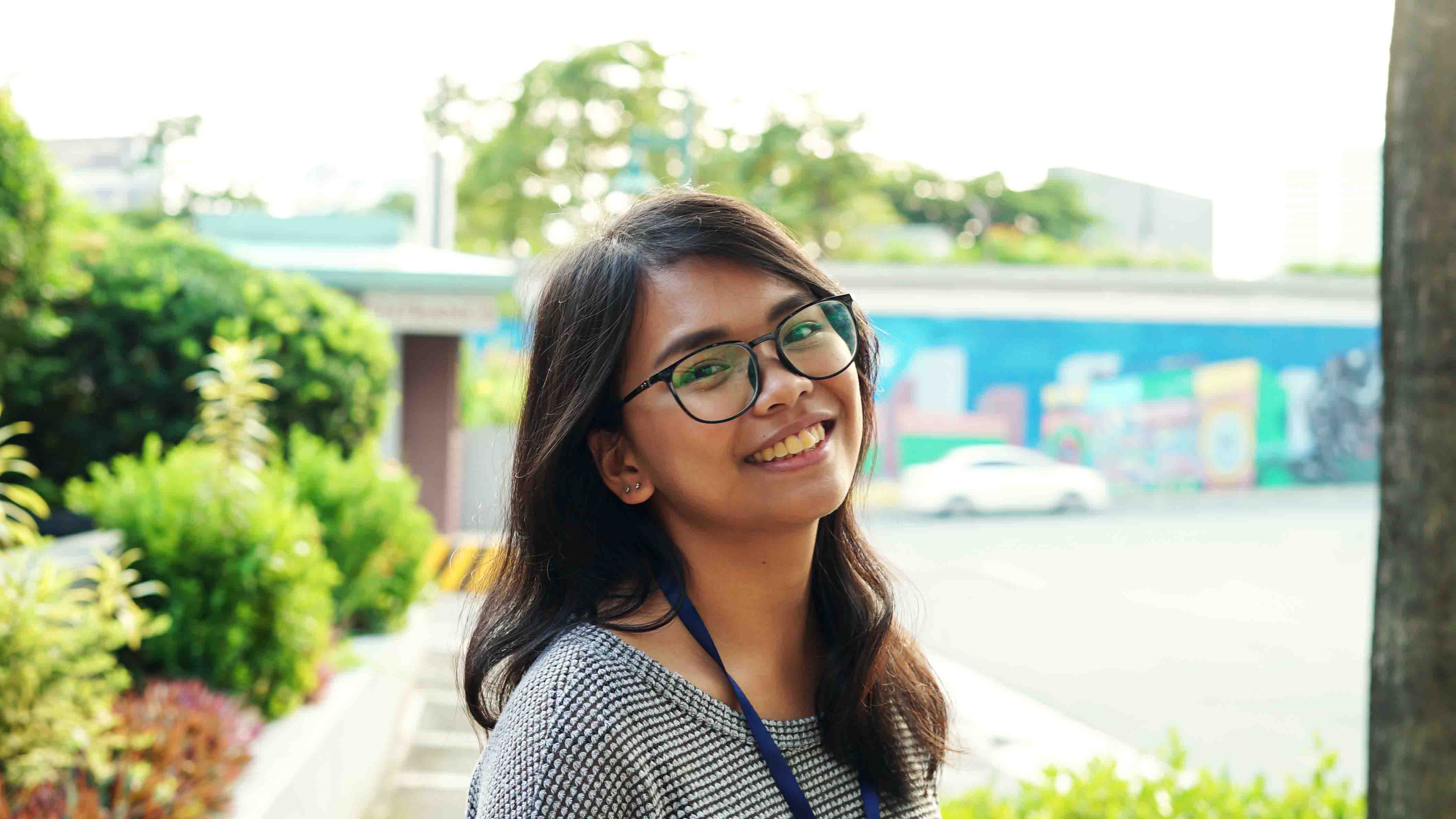 girl smiling in an outdoor setting