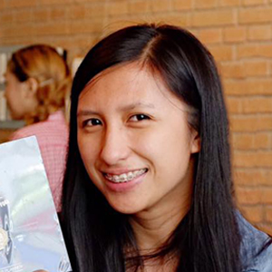 girl with long black hair smiling