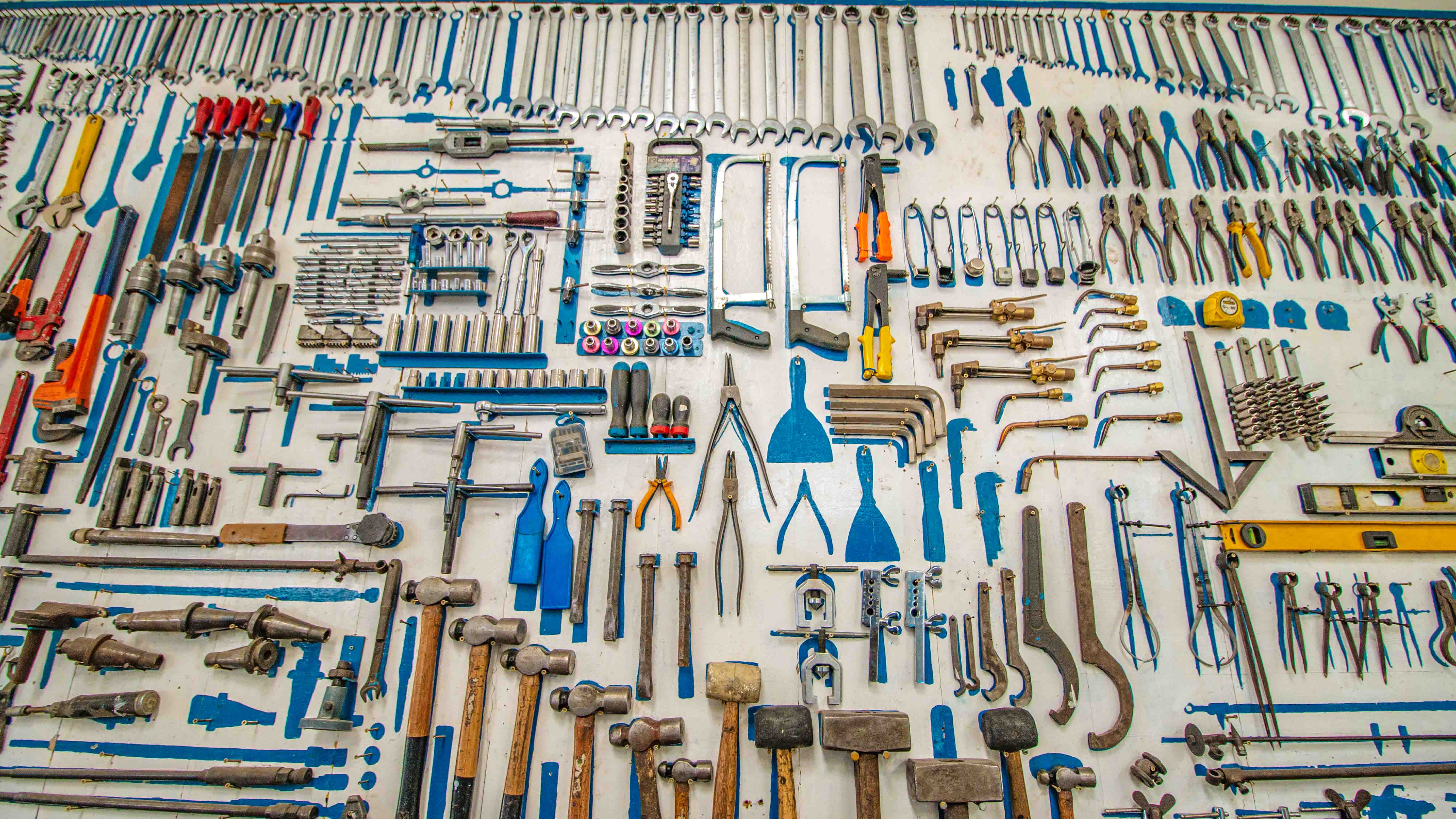 construction tools neatly hung up on a wall
