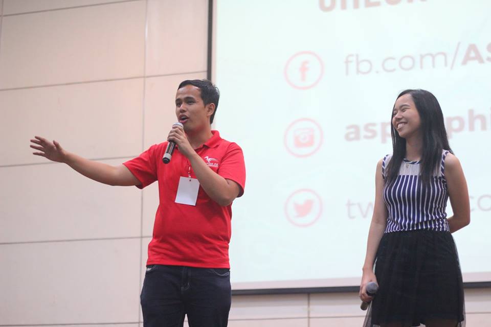 young man speaking on stage