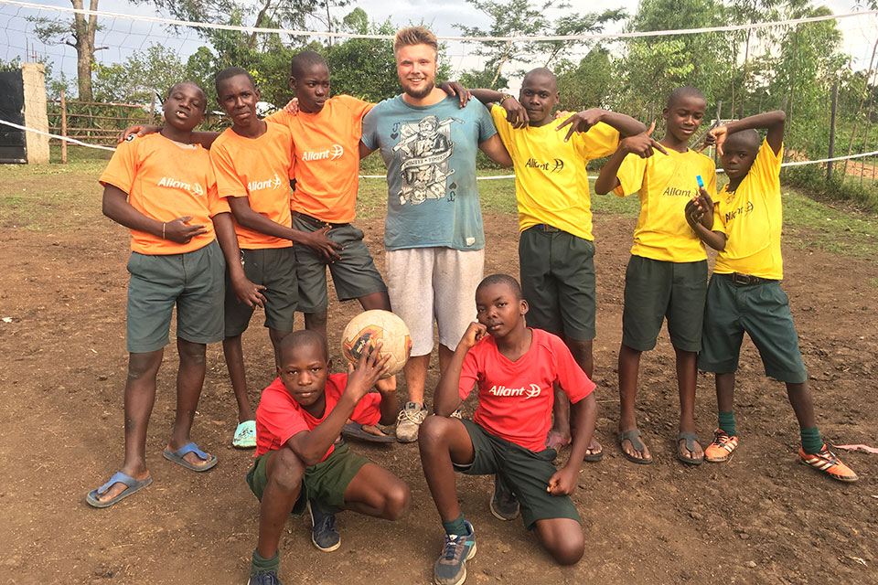 Rodríguez Alonso poses with children in the rural village in Kenya where he serves as long-term volunteer. He assists at the St. Vianney Education Center, which provides education, food and shelter, basic health care and recreational activities to vulnerable children.