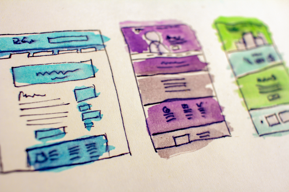 hand-drawn sketches of website wireframes