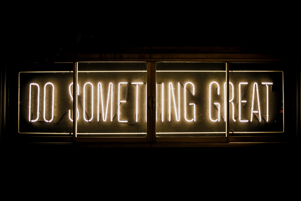 neon light with "do something great" written on it
