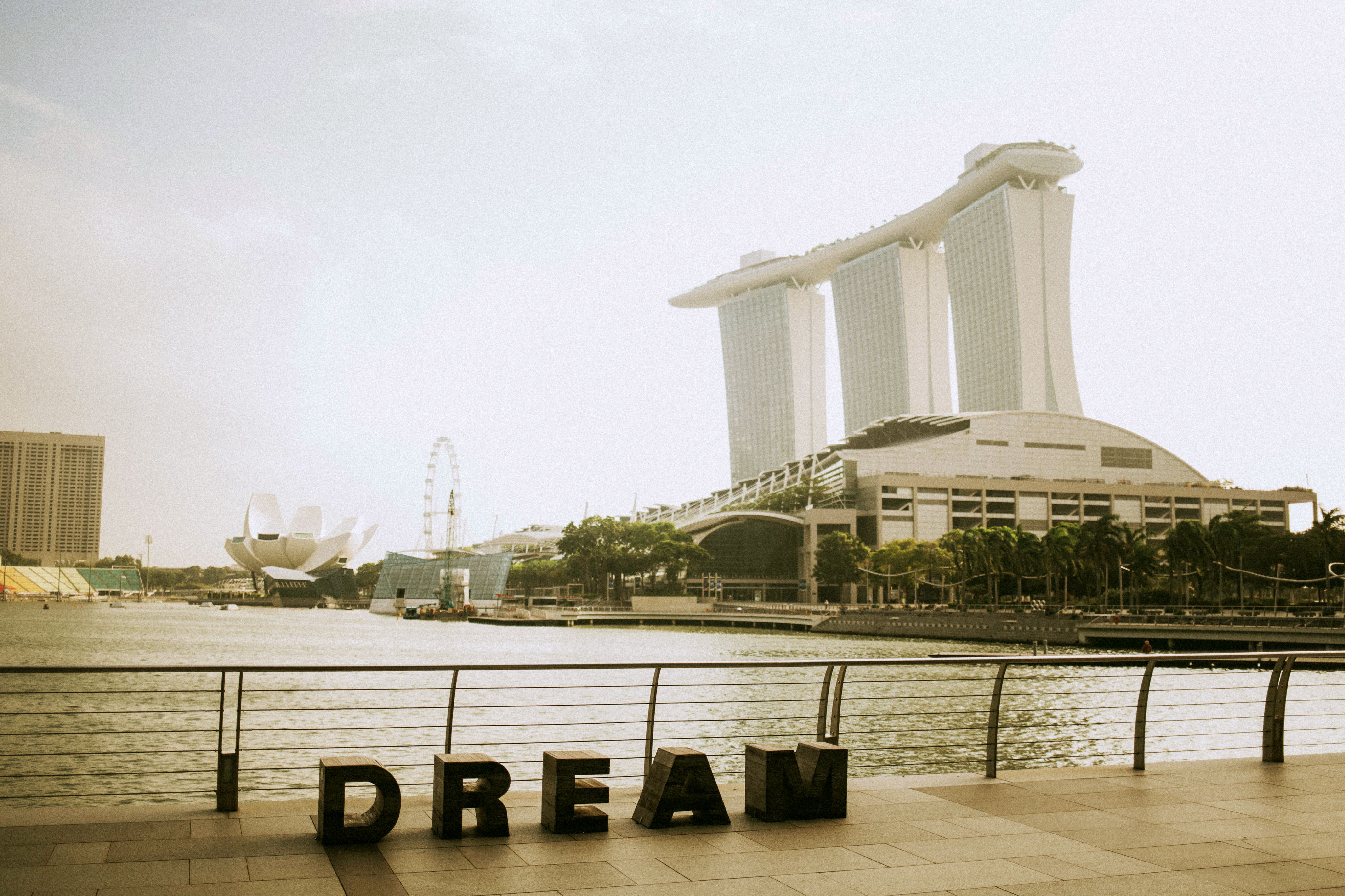 big dream lettering near fence verlooking Marina oBay sands building