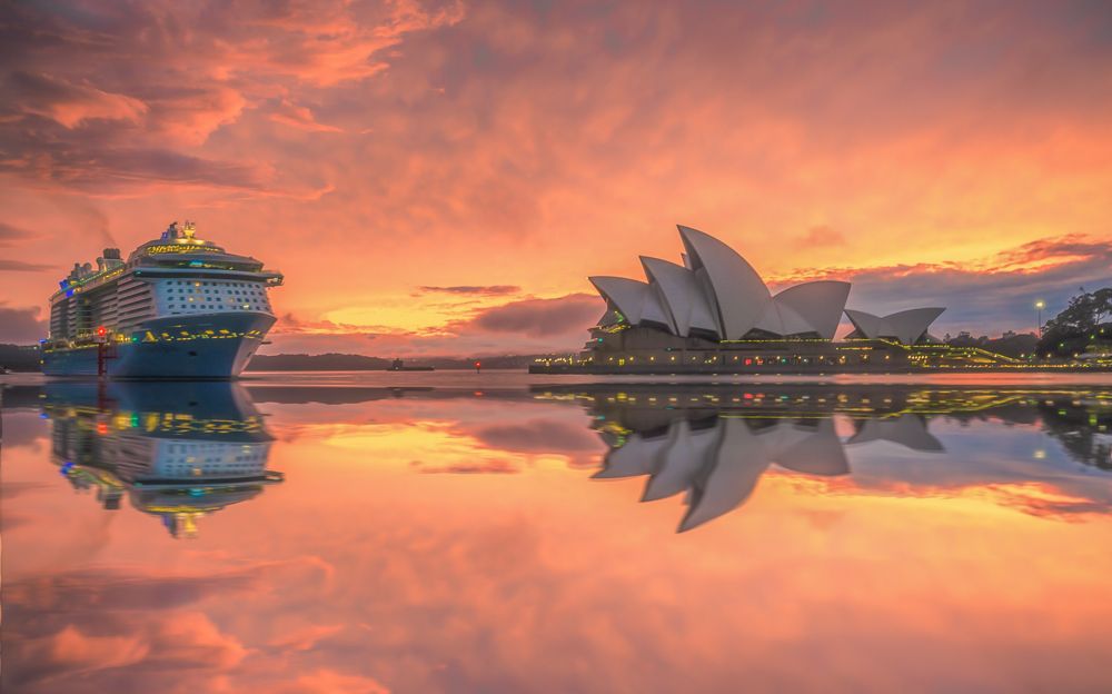 A boat sailing during the sunset in Sydney, Australia
