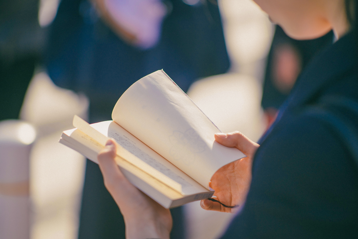 woman reading a book about how to prepare for ielts test for filipinos