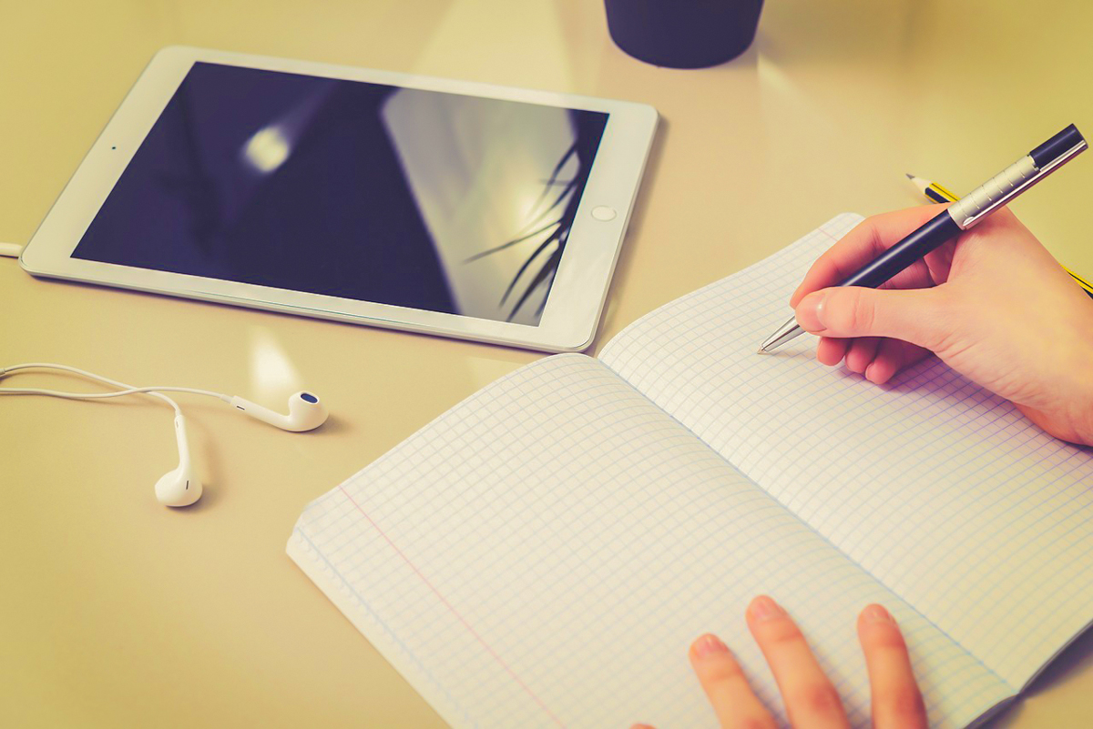student taking notes