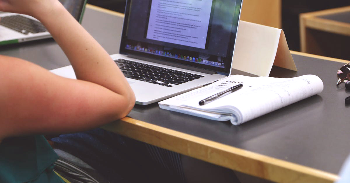Intern with a laptop and notebook
