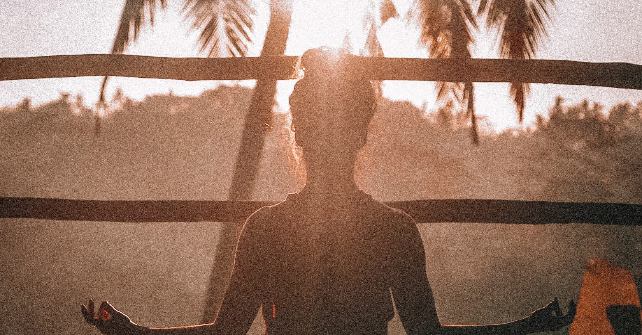 woman meditating under the sun