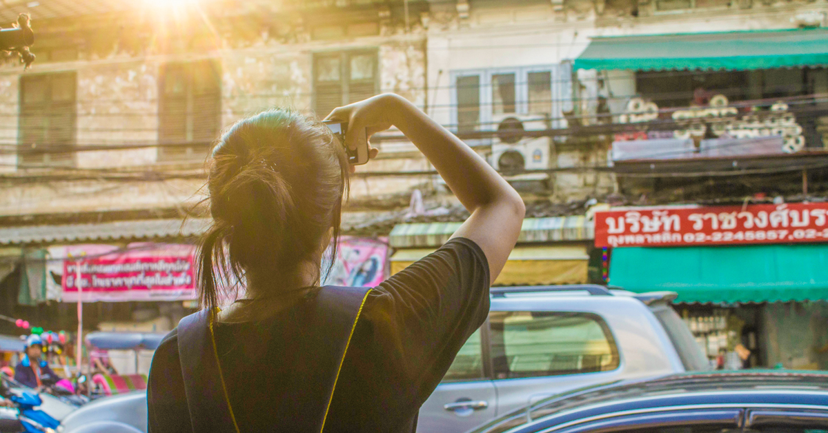 Girl taking a photo in Bangkok, Thailand