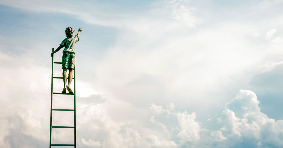 boy climbing a ladder reaching for the sky