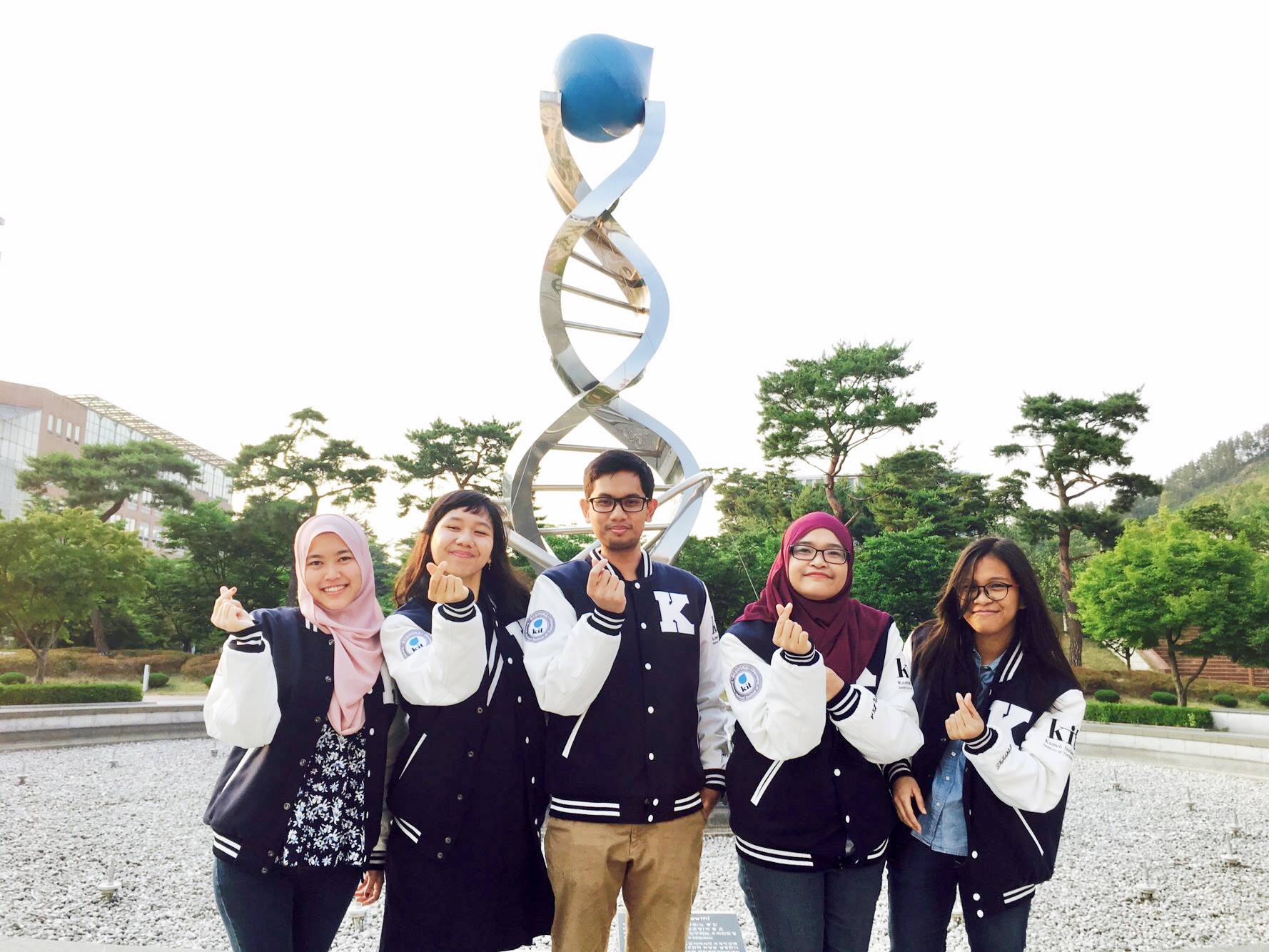 a group of international students holding up finger hearts
