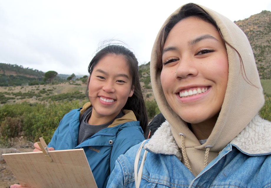 smiling students volunteer for the environment at saint louis university madrid