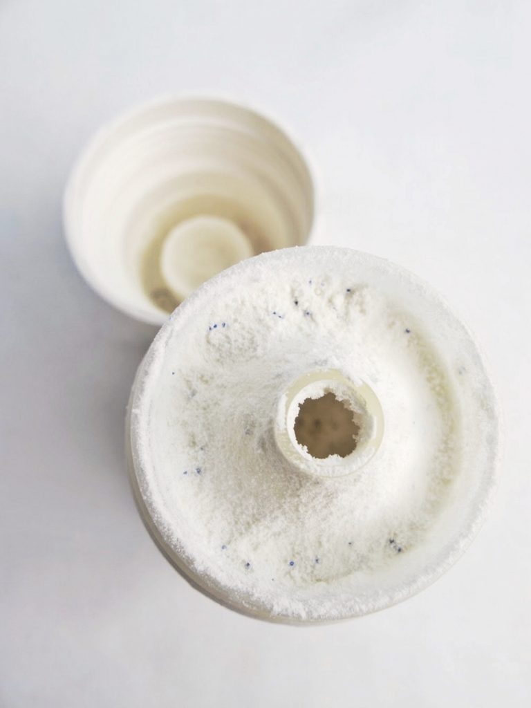 Packaging gripes: This is what happens when the bottle is kept in the bathroom for awhile.. (powder dampens and clumps in the inner cap rim)