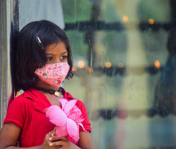 A little  girl came to temple wearing a mask
