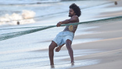 A man pulling fishing net