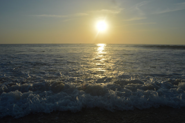 WAVES MEET THE SEASHORE