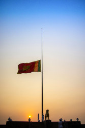 With the setting sun, the Flag gently lowers