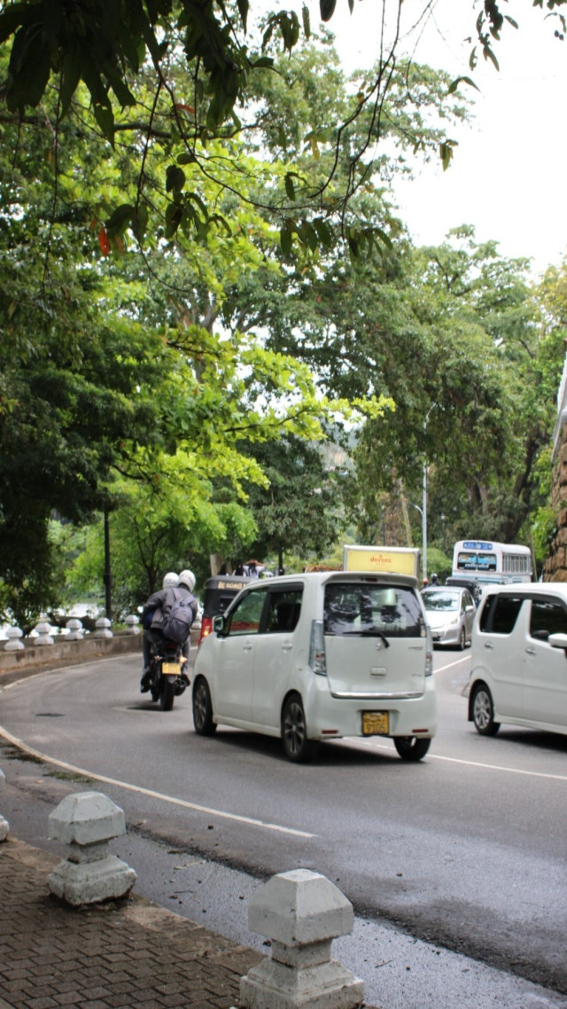 Busy street by the temple wall